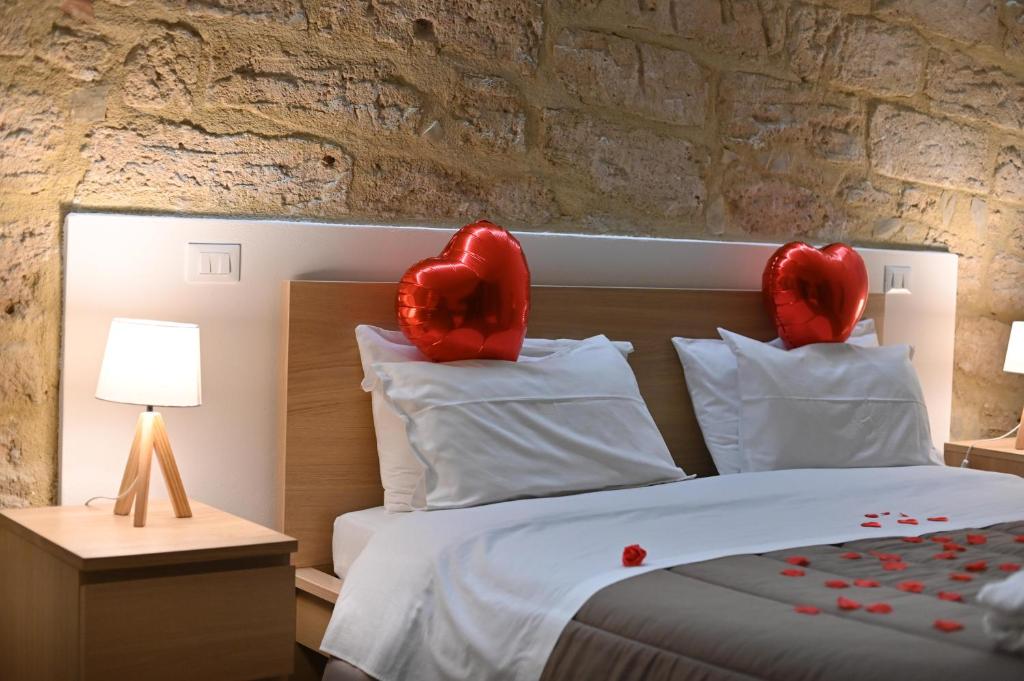 Postel nebo postele na pokoji v ubytování Boscò Suites