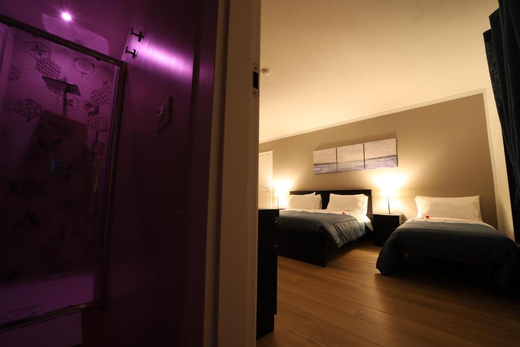 Postel nebo postele na pokoji v ubytování Boscò Suites