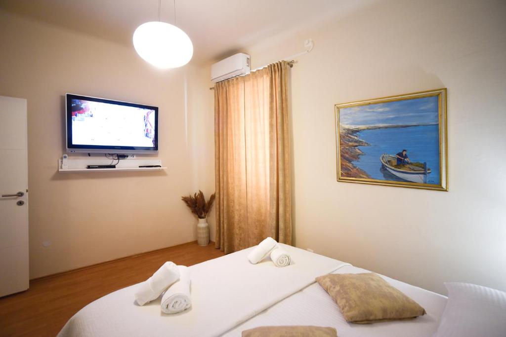 Posteľ alebo postele v izbe v ubytovaní Apartment Baćo
