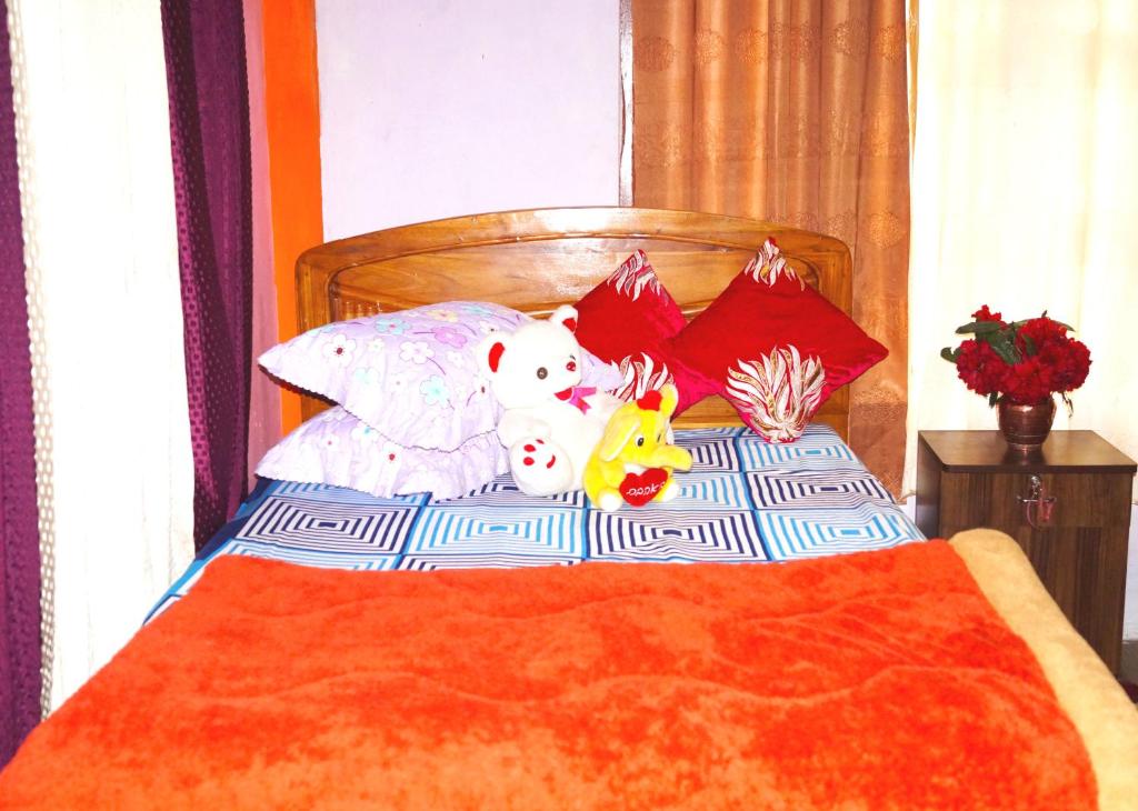 Postel nebo postele na pokoji v ubytování Yumasham Homestay
