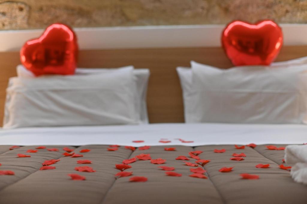 Postel nebo postele na pokoji v ubytování Boscò Suites