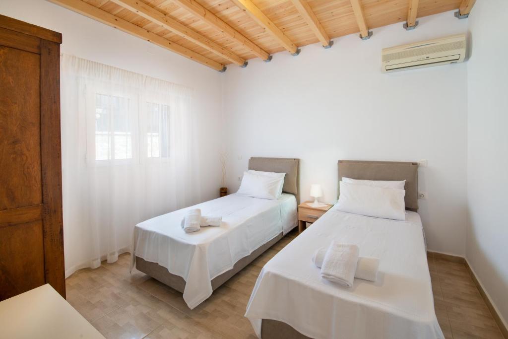 Postel nebo postele na pokoji v ubytování Vive Mar Paxos