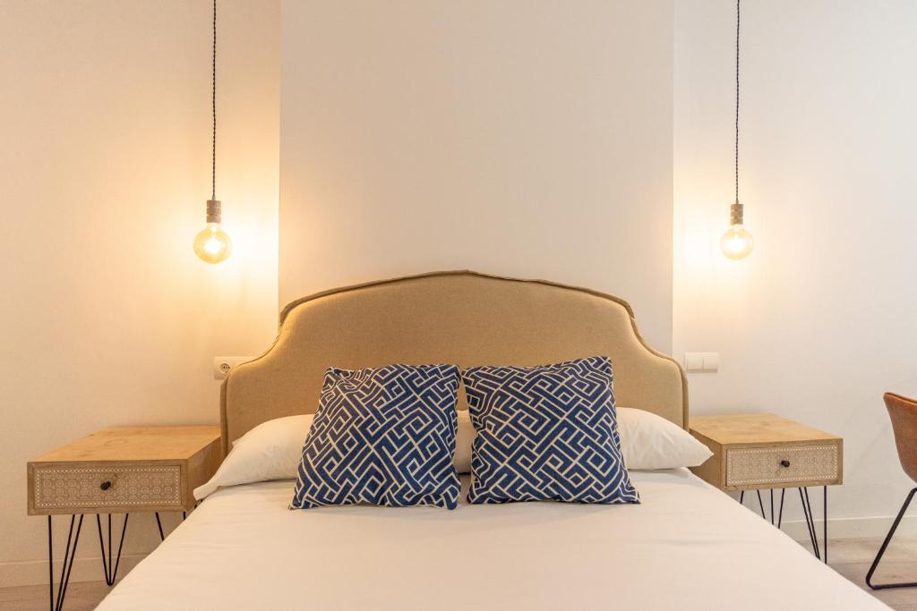 Posteľ alebo postele v izbe v ubytovaní Urbe10 Plaza de la Constucion Premium Loft