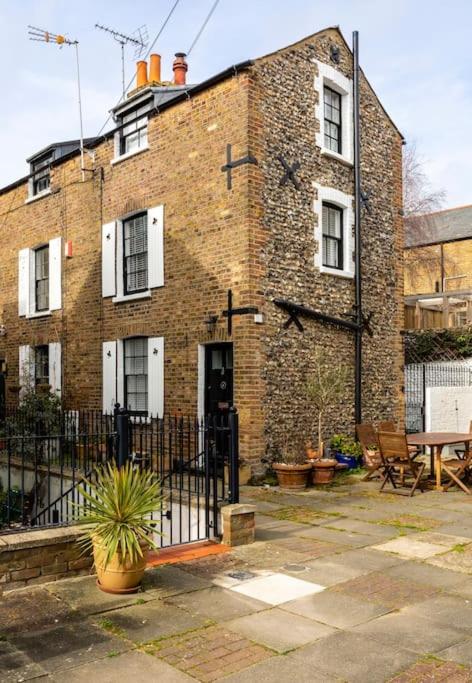 a brick building with a fence in front of it at Old Anchor Cottage in Broadstairs - Exclusive unmissable deals! Book now before it's too late! in Broadstairs