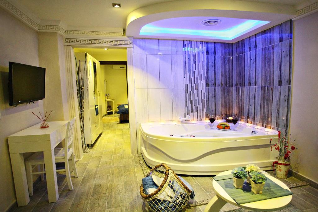a large bathroom with a tub in a room at Balance Hotel Taksim in Istanbul