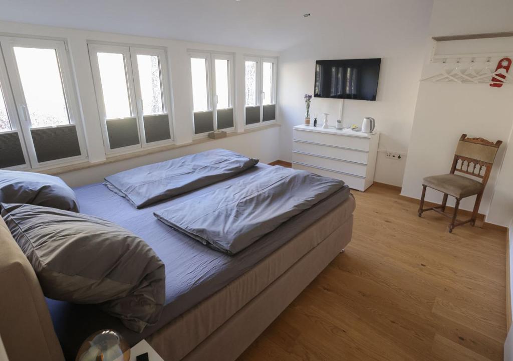 Postel nebo postele na pokoji v ubytování Residenz Kirchberg