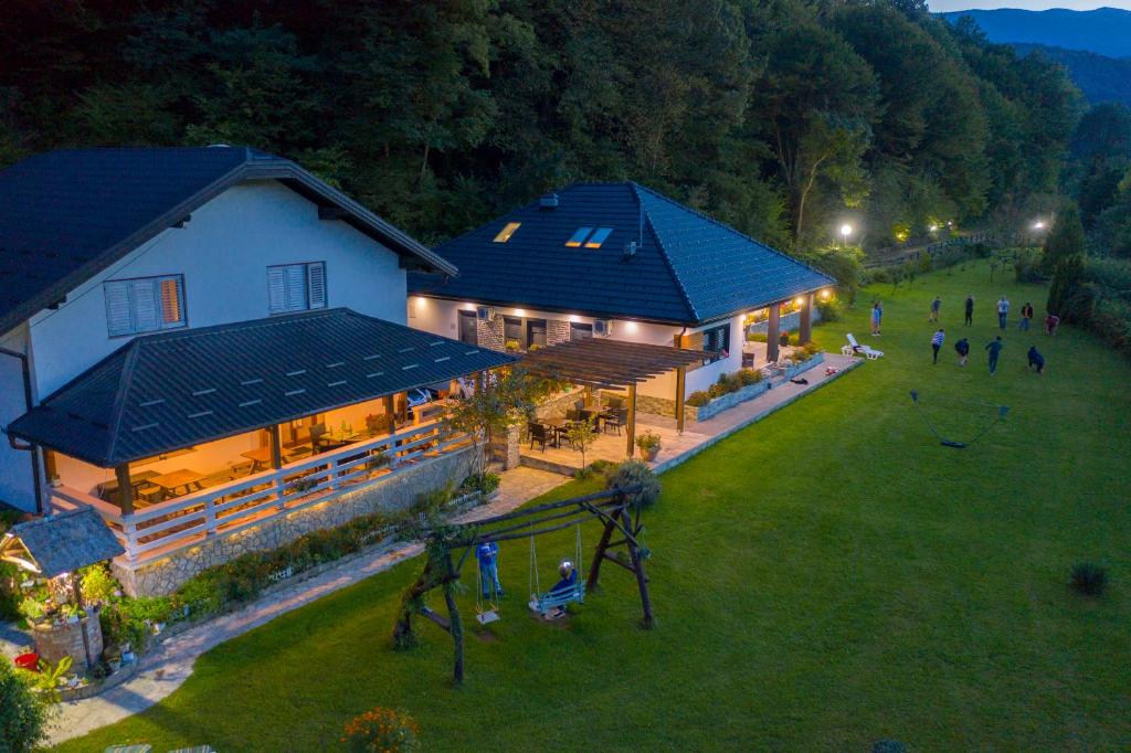 an aerial view of a house with a playground at Apartments Oeneus in Račić