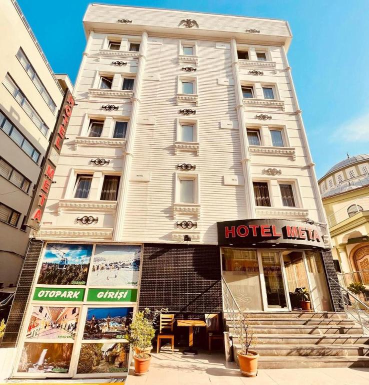 a hotel building with a hotel sign in front of it at Meta Hotel in Bursa