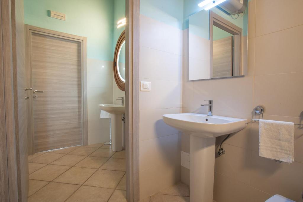 Koupelna v ubytování Hotel Caneo