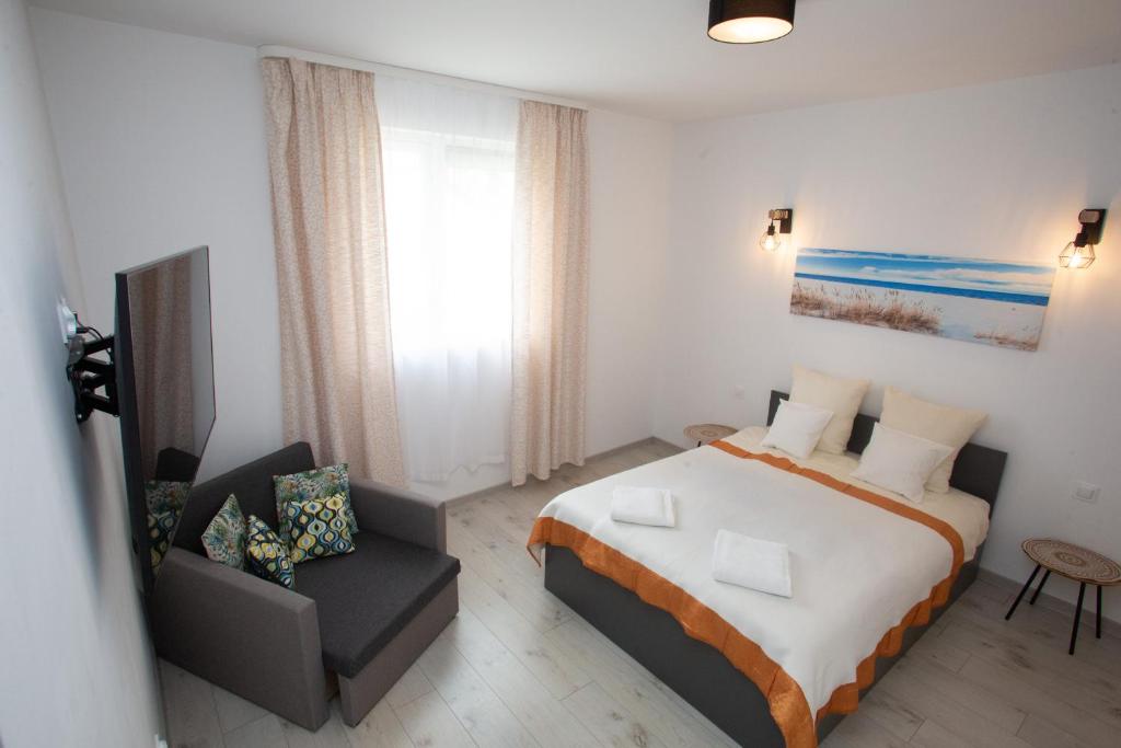 Postel nebo postele na pokoji v ubytování Stilo Hotel