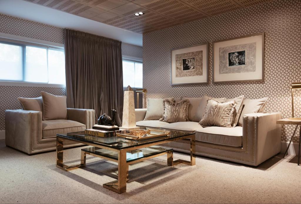 a living room with a couch and a coffee table at Hotel Van Cleef in Bruges