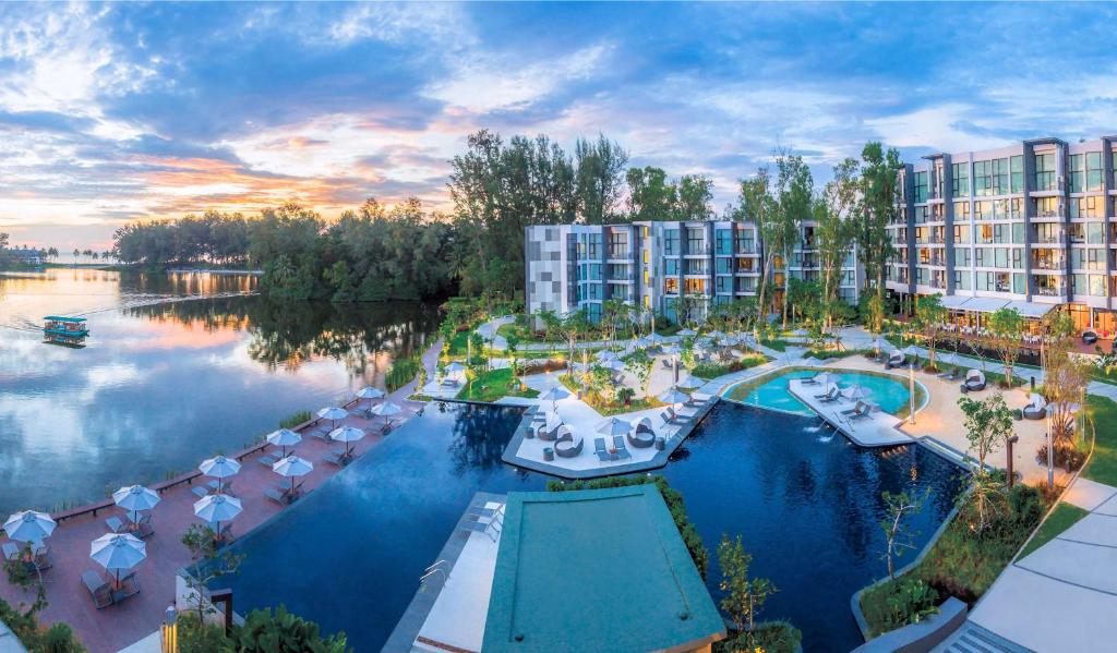 an aerial view of a resort with a large pool at Cassia Phuket in Bang Tao Beach