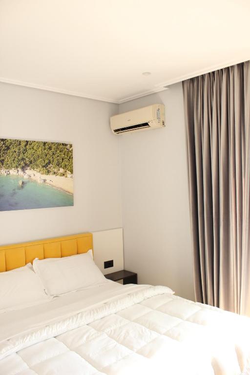 Postel nebo postele na pokoji v ubytování Bebi Hotel And Apartments