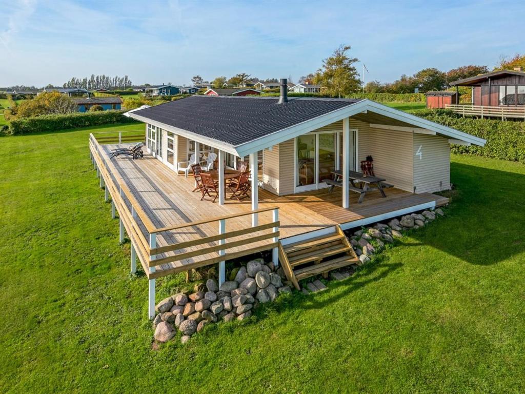 an overhead view of a house with a deck at Holiday Home Arton - 300m from the sea in Funen by Interhome in Ebberup