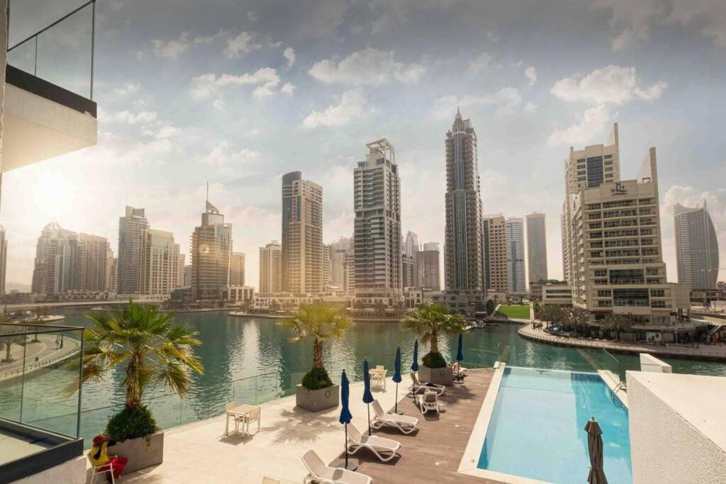 a view of a city skyline with a swimming pool at Dubai Marina, Ferienwohnung, Studio, Liv Residence in Dubai