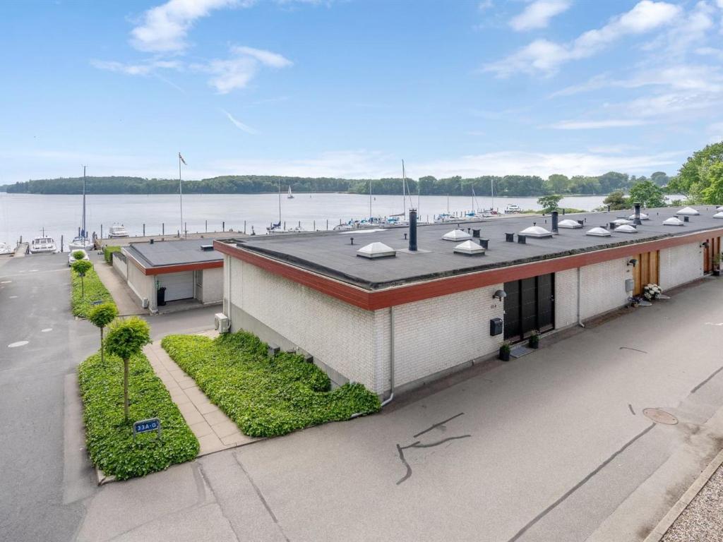 an aerial view of a building with a marina at Apartment Constance - 50m from the sea in Funen by Interhome in Svendborg