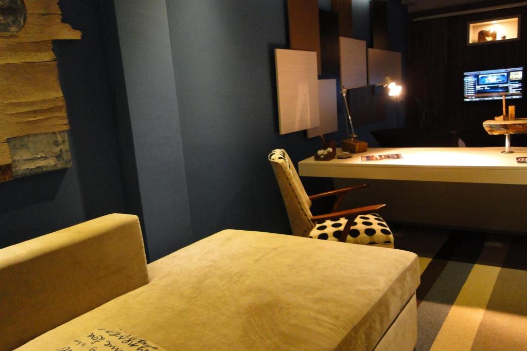 Ambit Boulevard Hotel Boutiqueにあるテレビまたはエンターテインメントセンター