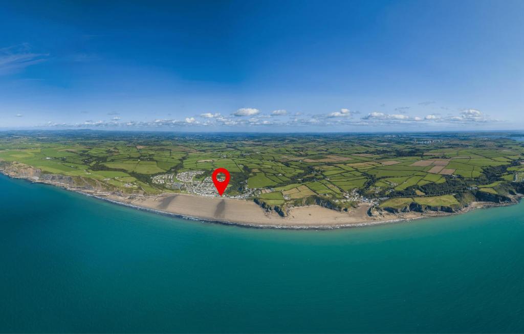 an island with a red marker in the middle of the ocean at Anchor Guest House in Haverfordwest