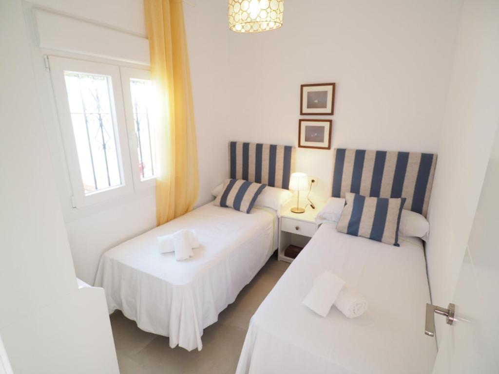 Posteľ alebo postele v izbe v ubytovaní Nerja Paradise Rentals - Villa Encanto