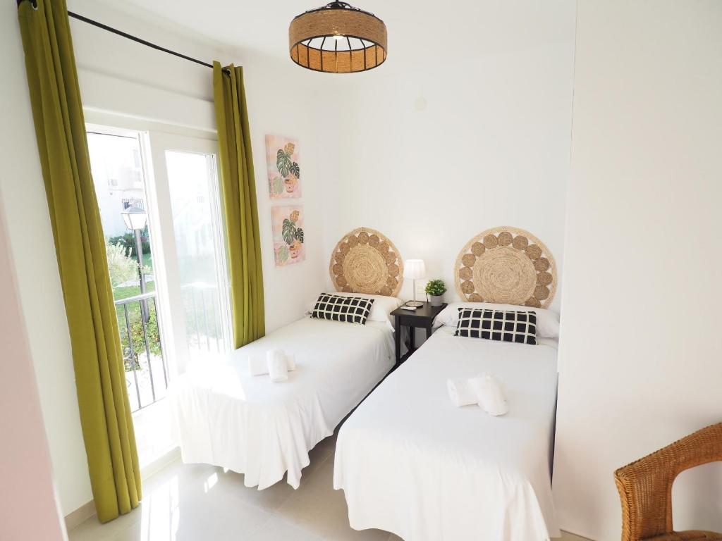 Posteľ alebo postele v izbe v ubytovaní Nerja Paradise Rentals - Villa Encanto
