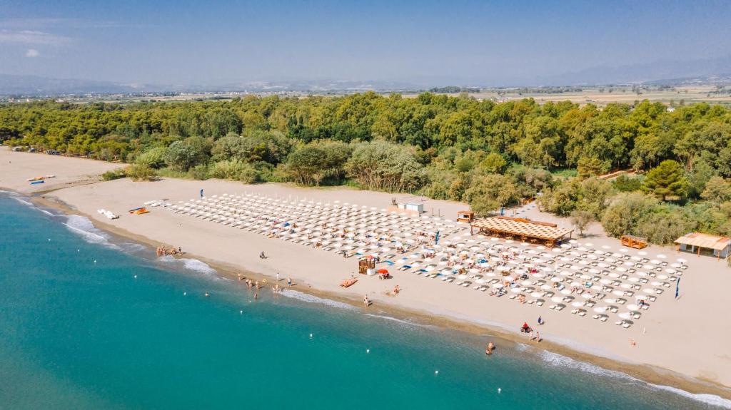 an aerial view of a beach with chairs and umbrellas at VALTUR OTIUM RESORT in Villapiana