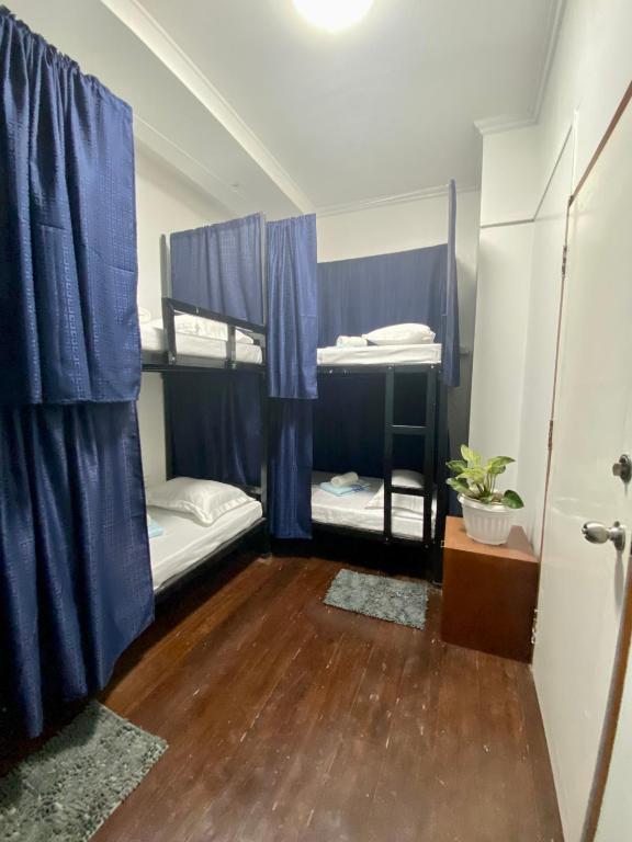 Postel nebo postele na pokoji v ubytování MyGuide Travellers Inn