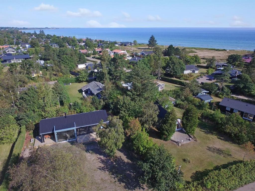 an aerial view of a house with the ocean at Holiday Home Yukon - 150m from the sea in SE Jutland by Interhome in Odder