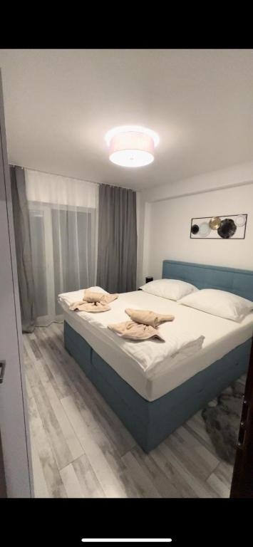 A bed or beds in a room at LUX apartmany Romantika CHOPOK 7, 19