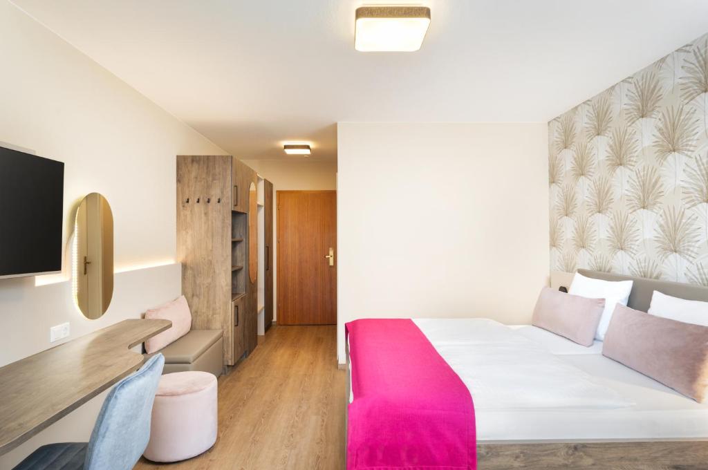 Postel nebo postele na pokoji v ubytování Hotel-Residenz Immenhof