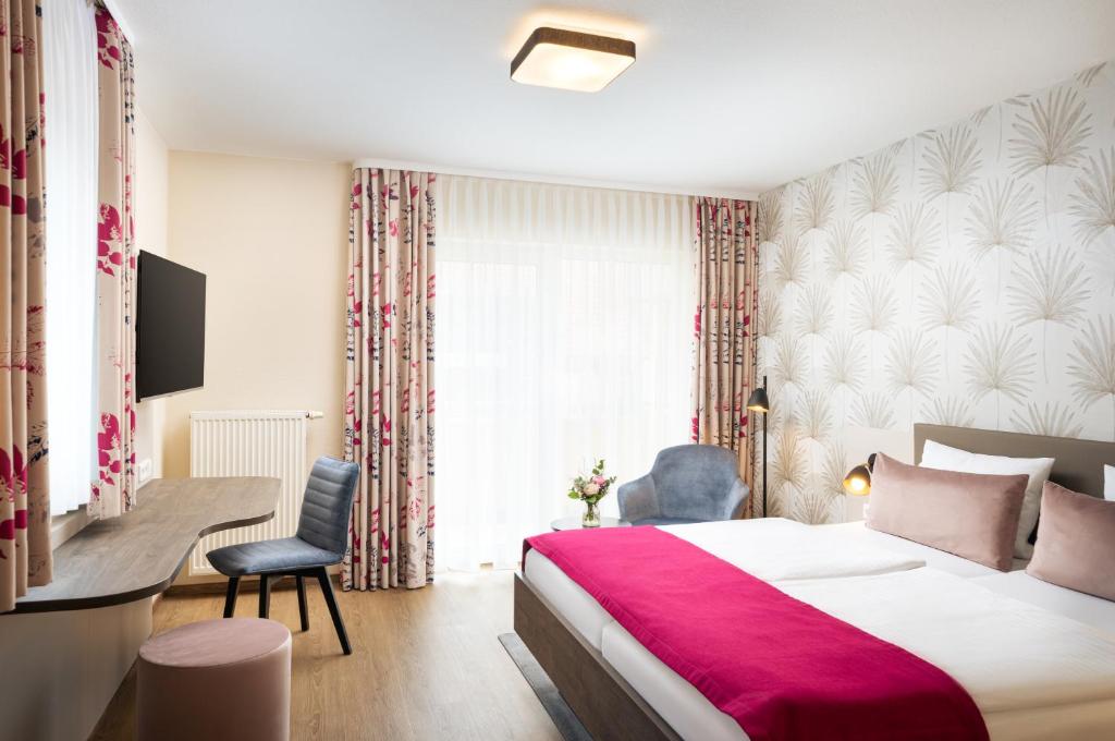 Postel nebo postele na pokoji v ubytování Hotel-Residenz Immenhof