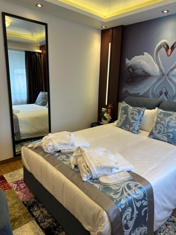 Postel nebo postele na pokoji v ubytování hotel whiteswan