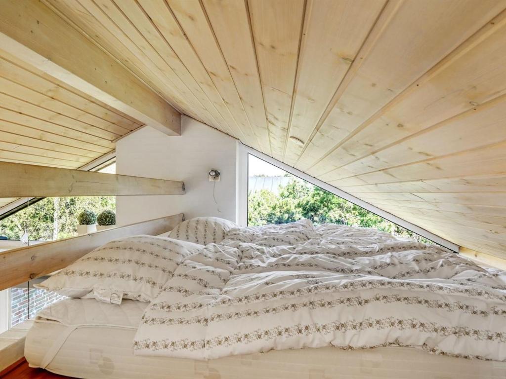 Postel nebo postele na pokoji v ubytování Holiday Home Ehlin - 150m from the sea by Interhome