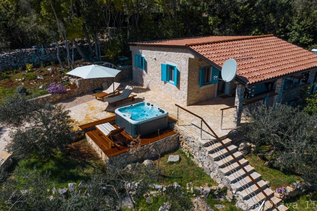 an aerial view of a house with a swimming pool at Holiday Home Casa Oliva II in Nerezine