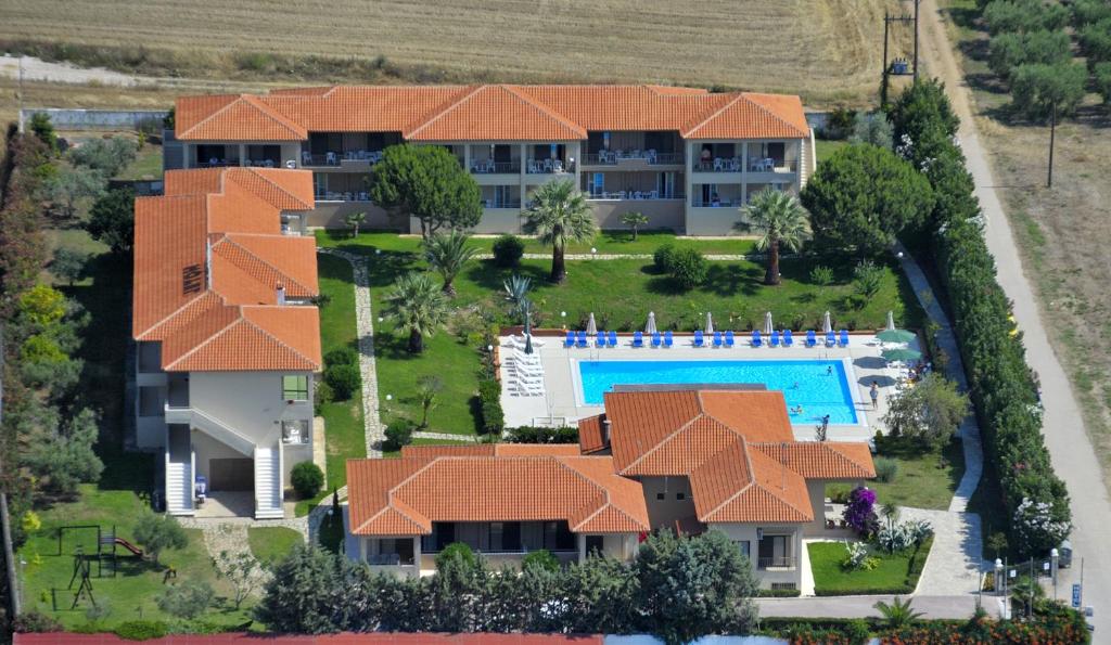 an aerial view of a house with a swimming pool at Kalives Resort in Kalives Poligirou