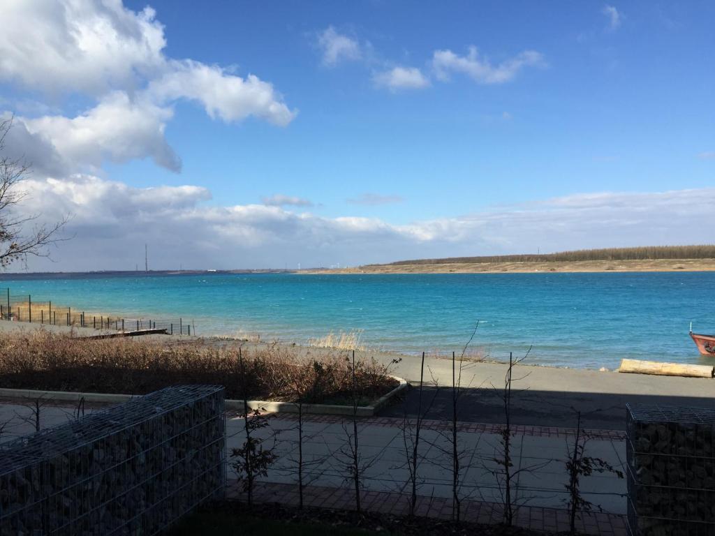 a view of the ocean from a beach at Apartment Zwenkauer See in Zwenkau