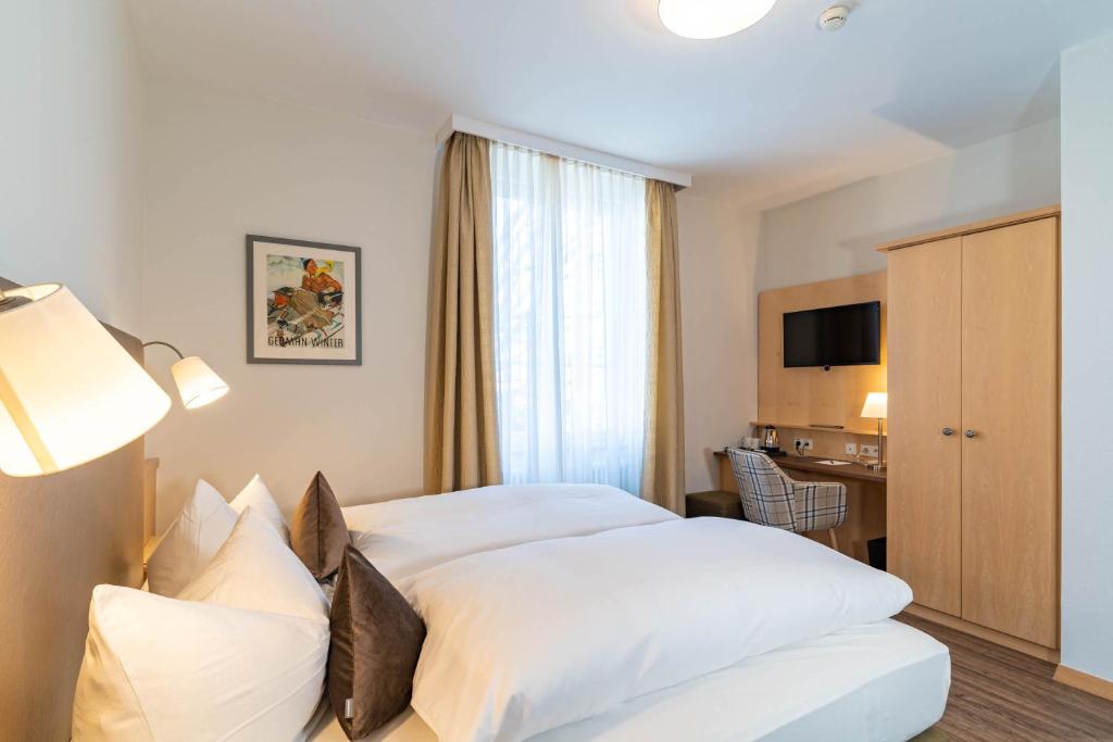 Postel nebo postele na pokoji v ubytování Apartment Hotel Schreier