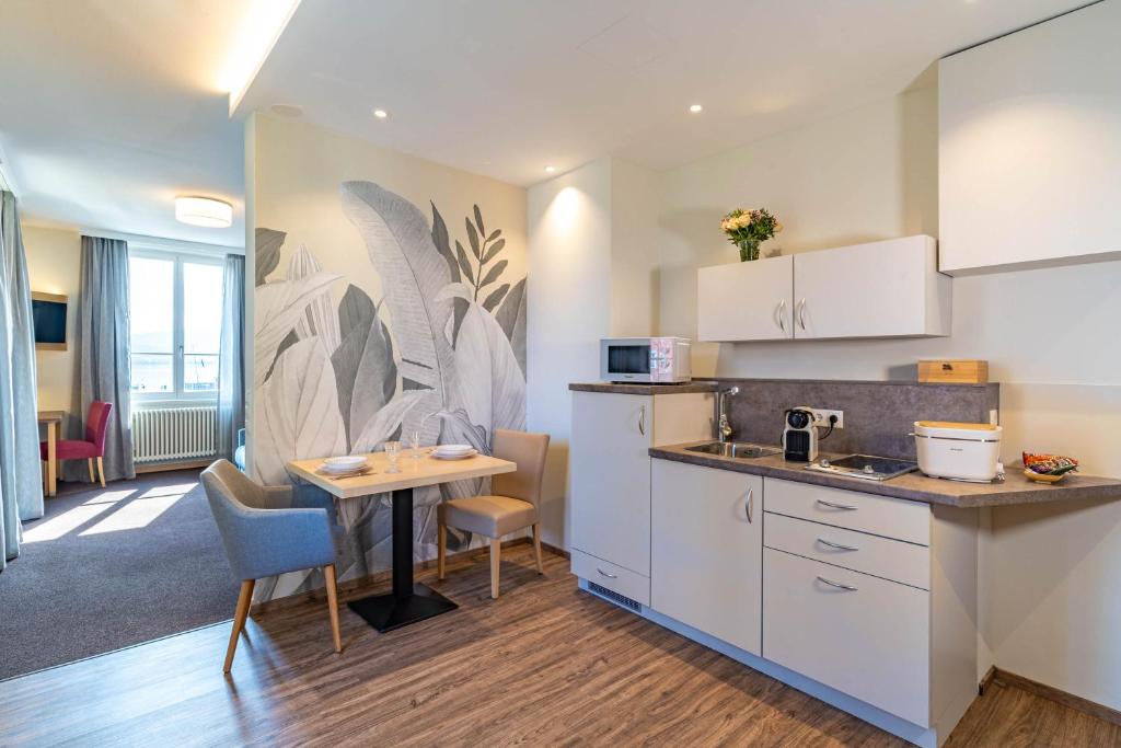 Kuchyň nebo kuchyňský kout v ubytování Apartment Hotel Schreier