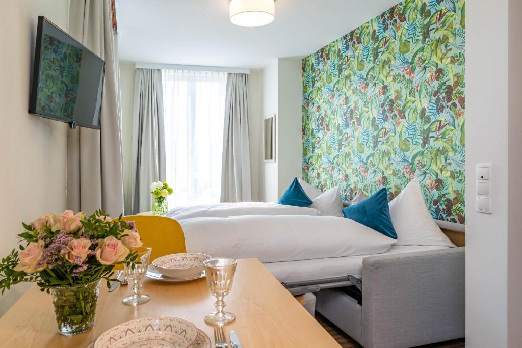 Postel nebo postele na pokoji v ubytování Apartment Hotel Schreier