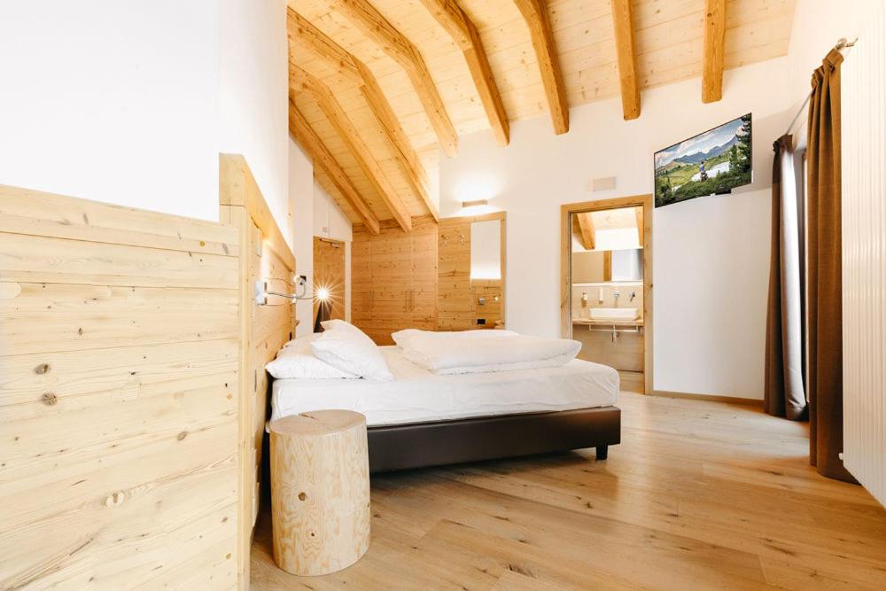 Postel nebo postele na pokoji v ubytování Hotel Aurai