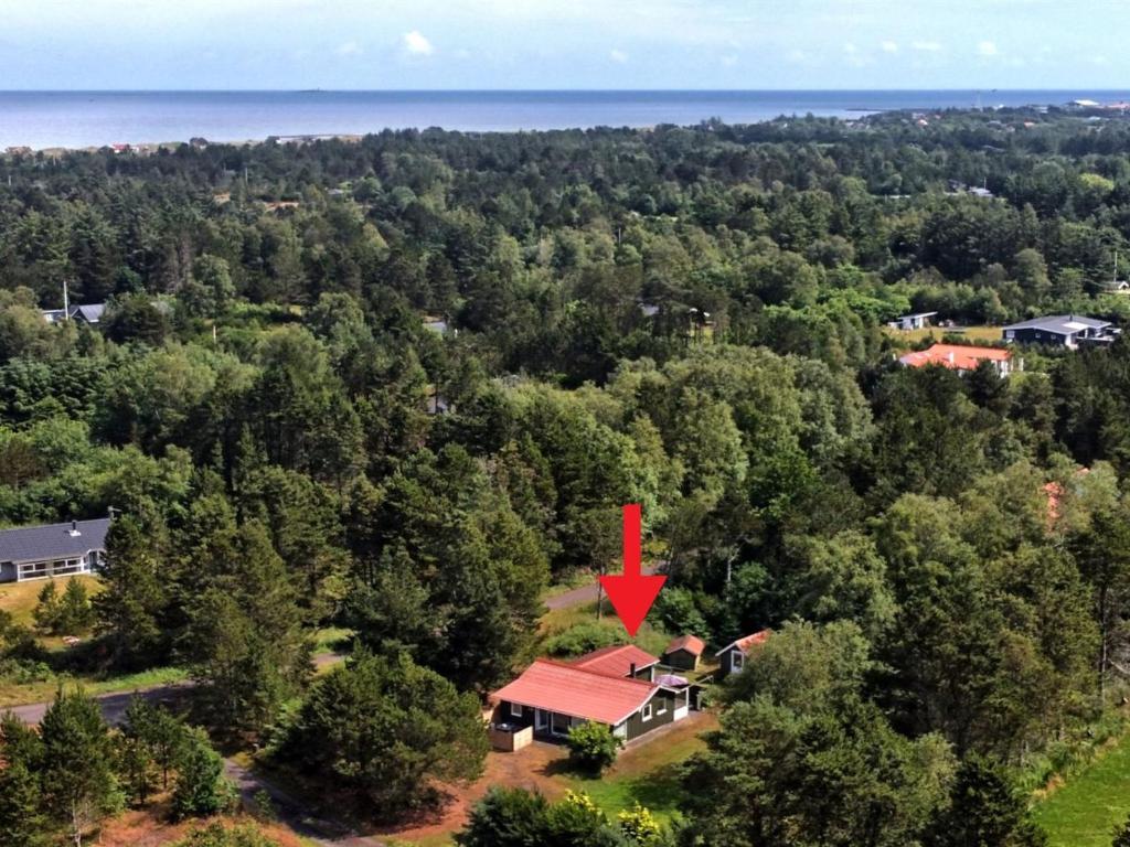 an aerial view of a house with a red roof at Holiday Home Elmer - 400m from the sea in NE Jutland by Interhome in Jerup