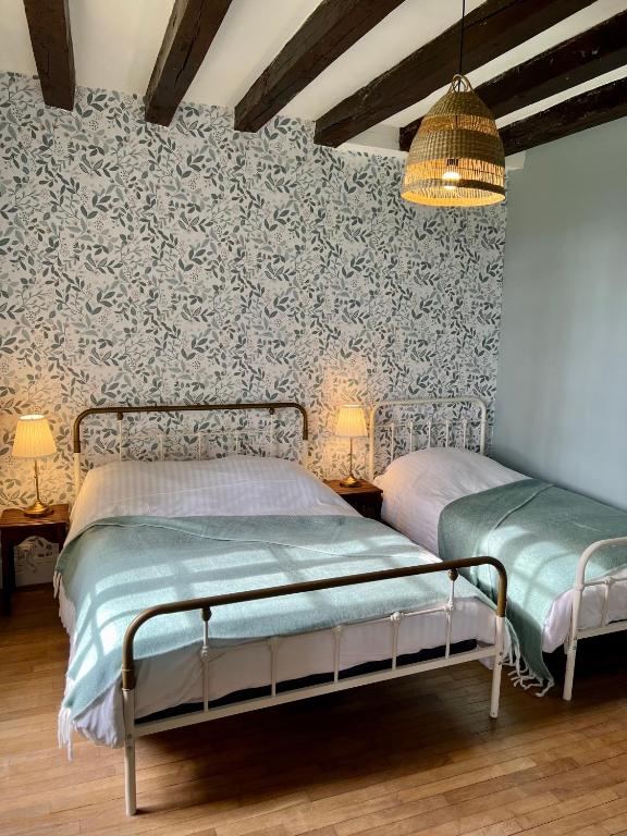 Posteľ alebo postele v izbe v ubytovaní La maison de la tour