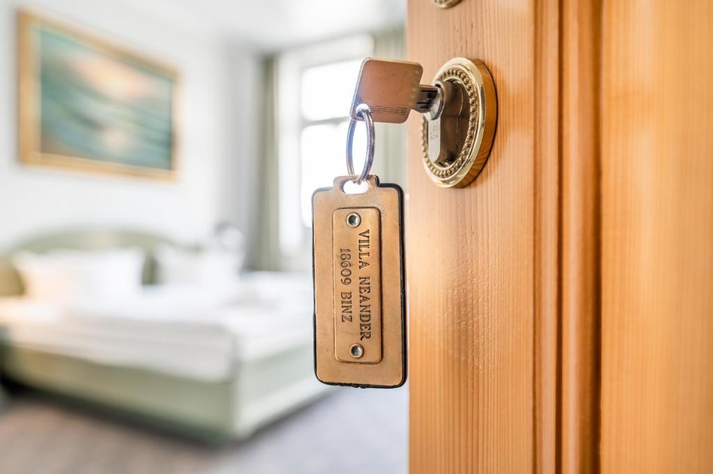 Postel nebo postele na pokoji v ubytování Hotel Villa Neander