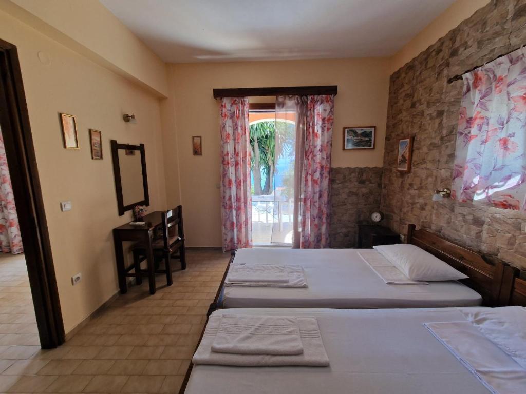 Postel nebo postele na pokoji v ubytování Atisis Apartments