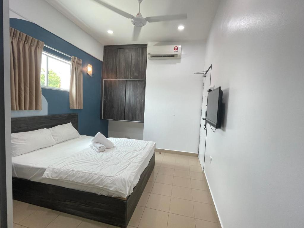 Postel nebo postele na pokoji v ubytování MR Homestay HotelStyle Room Teluk Intan