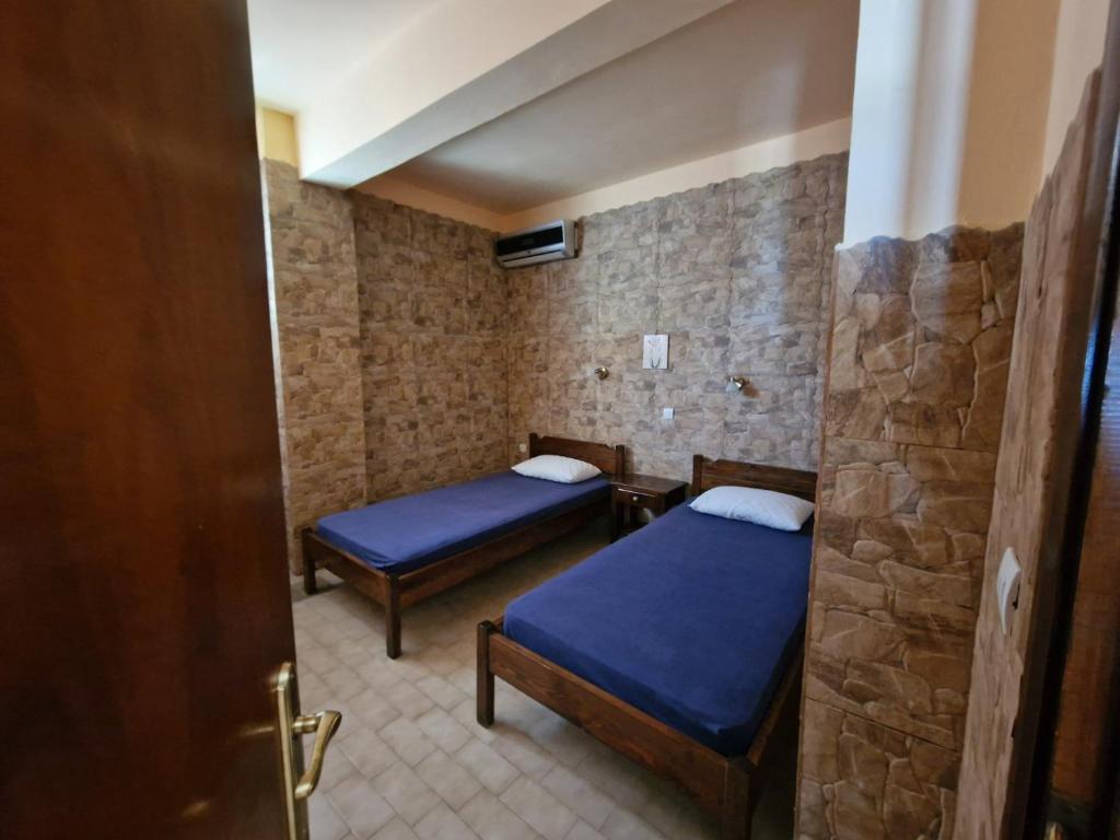 Postel nebo postele na pokoji v ubytování Atisis Apartments