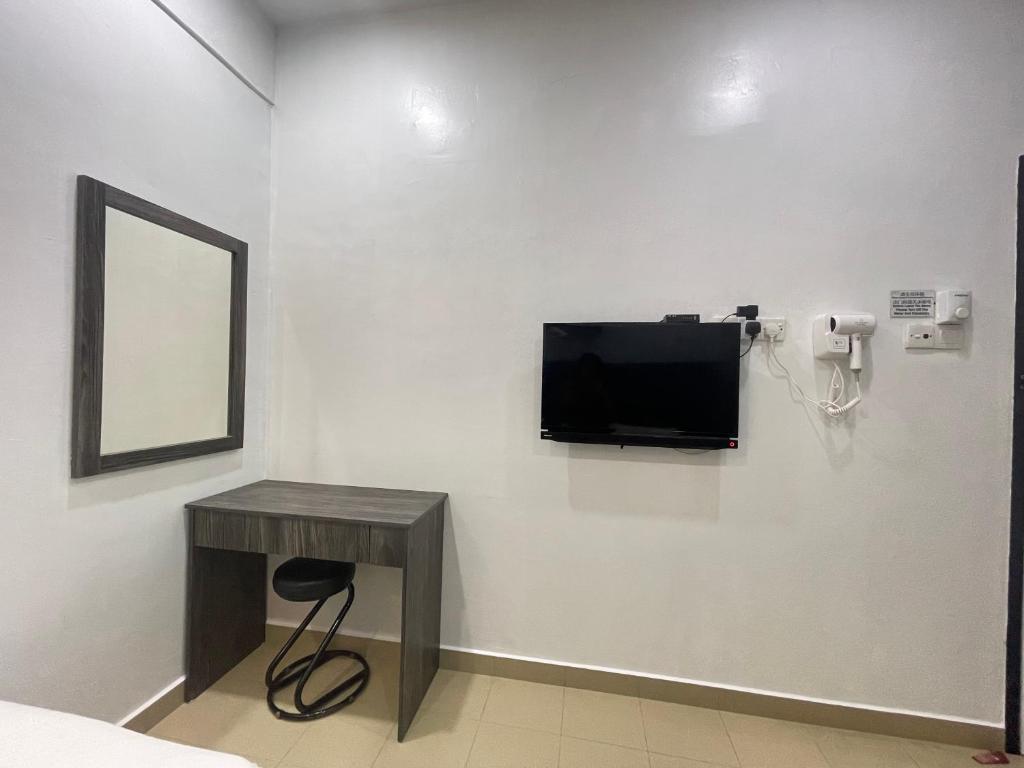 TV a/nebo společenská místnost v ubytování MR Homestay HotelStyle Room Teluk Intan