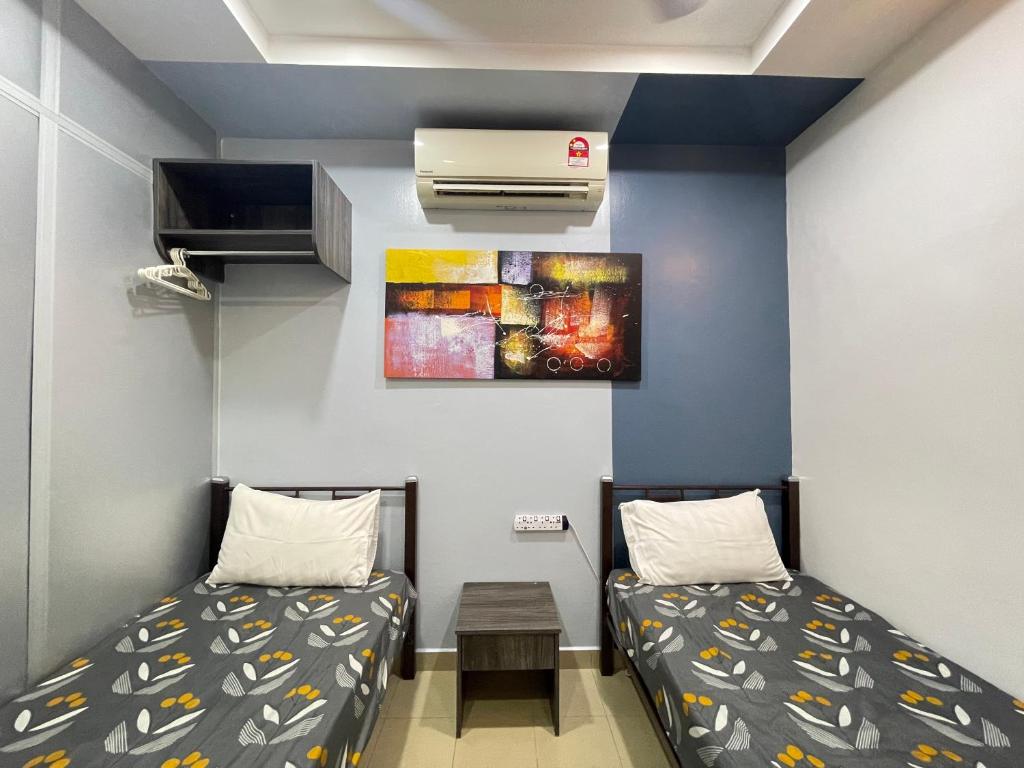 Postel nebo postele na pokoji v ubytování MR Homestay HotelStyle Room Teluk Intan