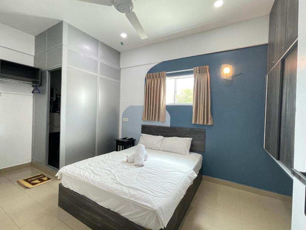 Postel nebo postele na pokoji v ubytování MR Homestay HotelStyle Room Teluk Intan