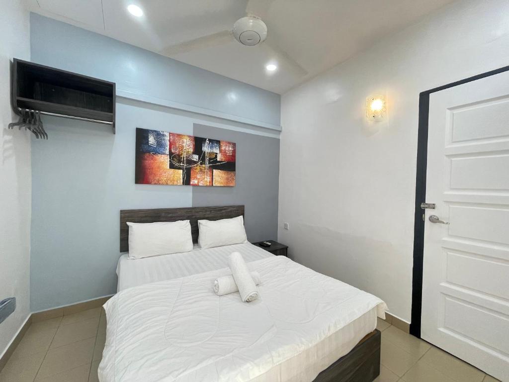 Postel nebo postele na pokoji v ubytování MR Homestay HotelStyle Room Teluk Intan