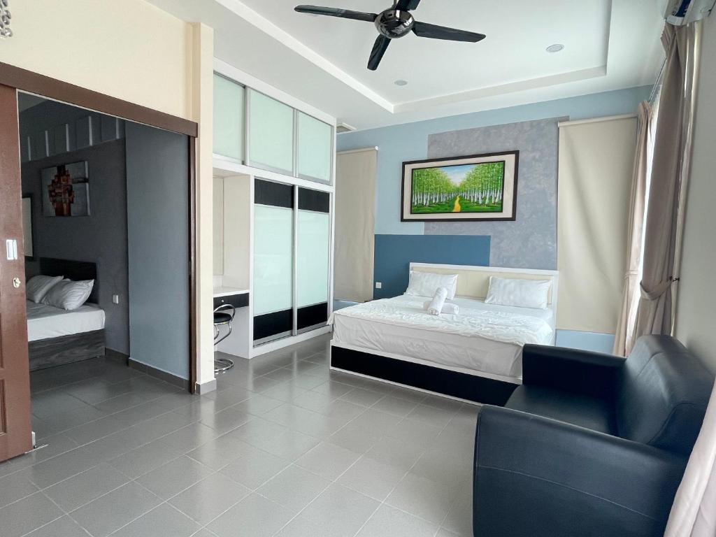 Postel nebo postele na pokoji v ubytování MR Homestay HotelStyle Room Teluk Intan
